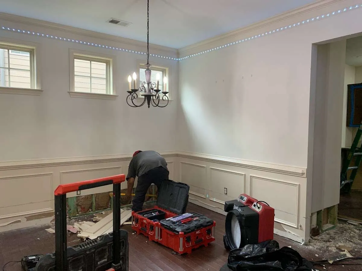 Restoration technician with professional equipment in New York